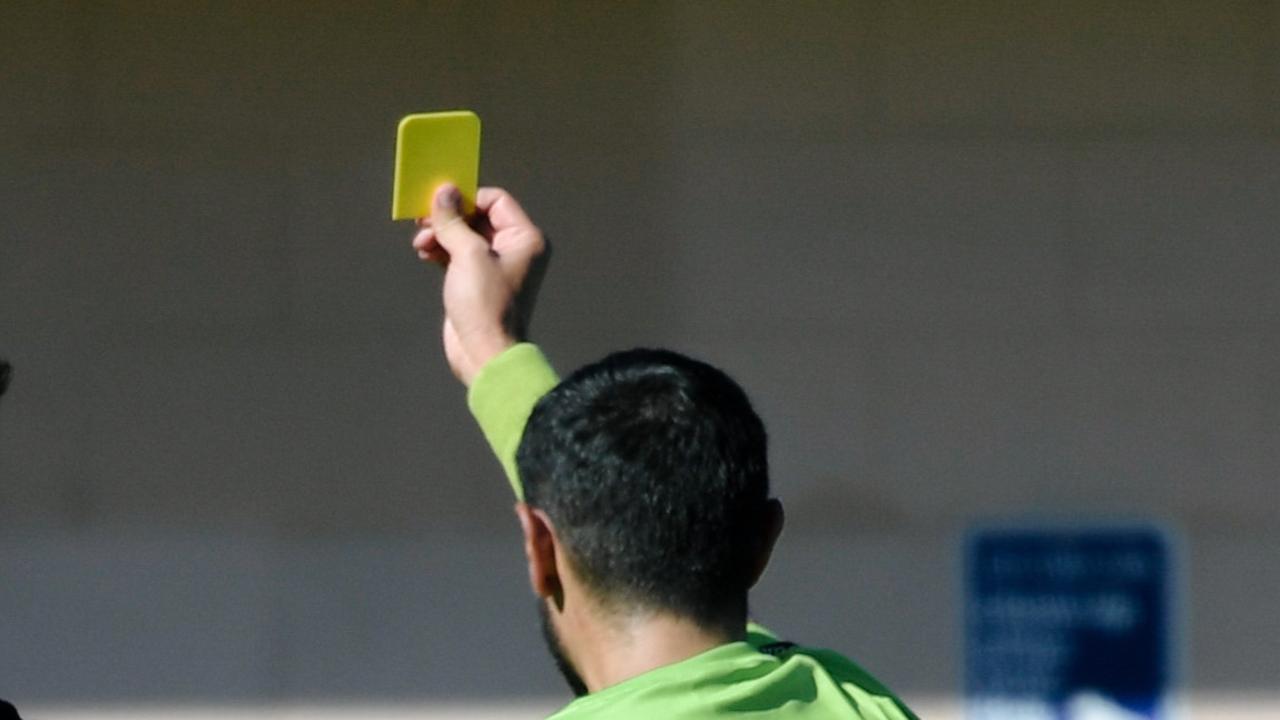 Ryan Spittle reacts while getting yellow-carded by an umpire during the Goodwood Saints versus Tea Tree Gully game in Adelaide, Saturday, April 21, 2018.  (AAP Image/Morgan Sette)