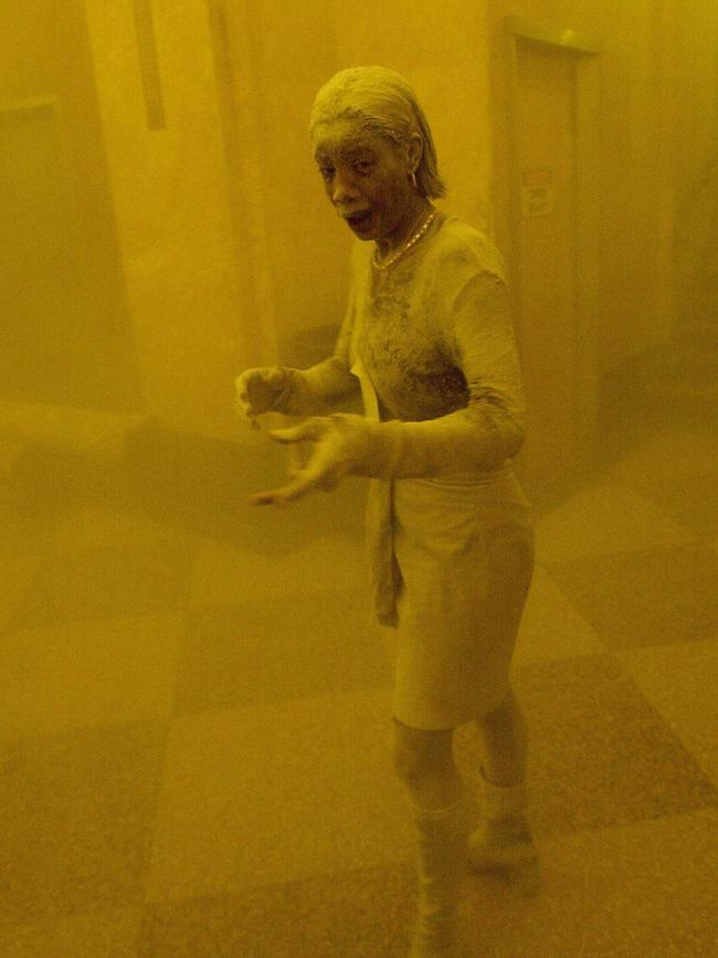 New Yorker Marcy Borders, covered in dust, takes refuge in an office building after one of the World Trade Center towers was hit in the 9/11 terror attacks. She later died of stomach cancer.