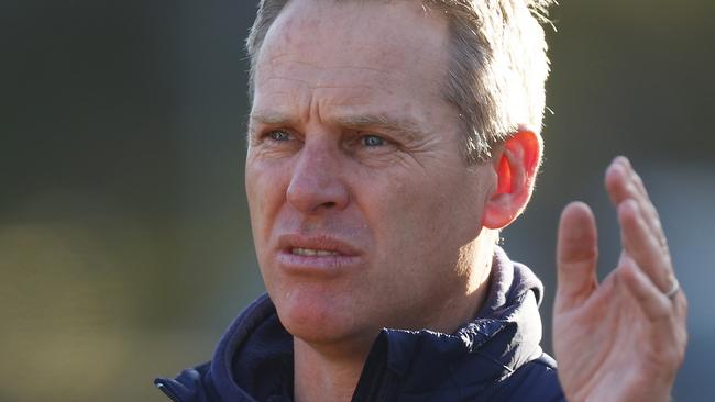 MELBOURNE, AUSTRALIA - JULY 10: Falcons head coach Paul Corrigan speaks to his players during the NAB League Boys match between Geelong and the Bendigo Pioneers at Avalon Airport Oval on July 10, 2022 in Melbourne, Australia. (Photo by Daniel Pockett/AFL Photos/via Getty Images)