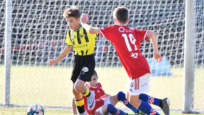 SOCCER: Junior football carnival, Maroochydore. Gold Coast Knights (red) V Moreton Bay United, boys. Picture: Patrick Woods.