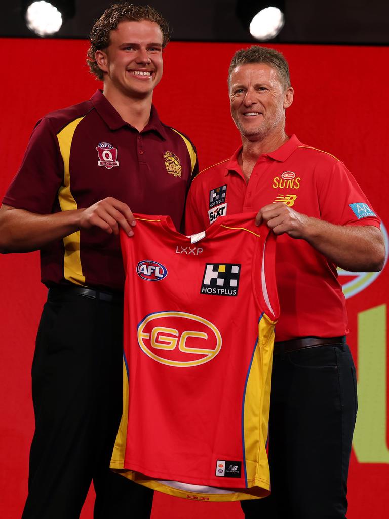 Damien Hardwick presenting the Gold Coast jumper to Jed Walter. Picture: Michael Klein