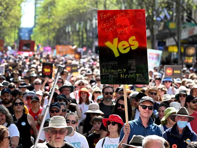 Crowds march during a "Walk for Yes" rally in Melbourne on September 17, 2023. Thousands joined "Walk for Yes" events in major cities, ahead of the referendum that could grant Indigenous Australians a constitutionally enshrined right to be consulted on policies that affect them -- a "Voice to Parliament". (Photo by William WEST / AFP)