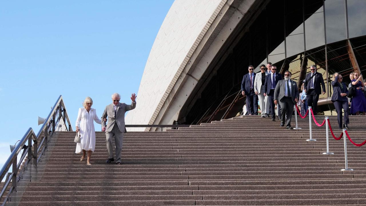 King Charles waves beside Queen Camilla as they visited Sydney Opera House. Picture: Mark Baker / POOL / AFP