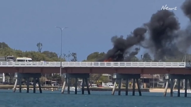 Crash ignites car fire on Bribie Island Bridge