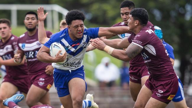 Bulldog's star Paul Alamoti breaking through the Manly defence.