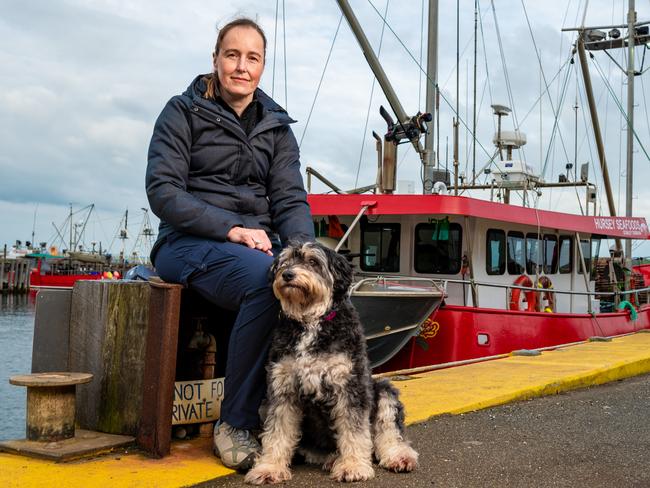 Di Maynard with her dog Daisy at Stanley where she helped attend to a 10-year-old boy who had been attacked by a shark. Picture: CORDELL RICHARDSON