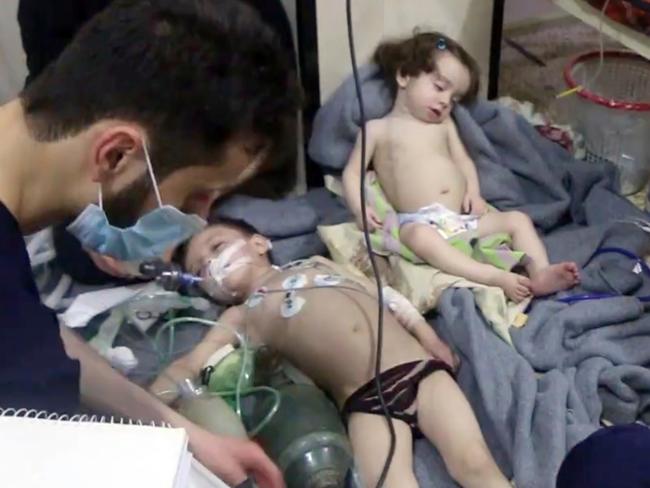 Medical workers treating toddlers following a poison gas attack in the opposition-held town of Douma, in eastern Ghouta, near Damascus, Syria.