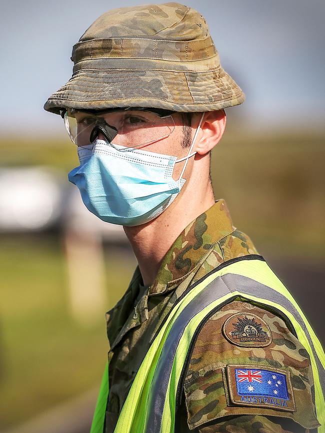 An Australian Defence Force member at a vehicle checkpoint near Geelong. Picture: Ian Currie