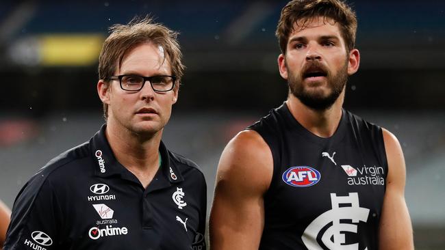 MELBOURNE, AUSTRALIA - MARCH 19: David Teague, Senior Coach of the Blues and Levi Casboult of the Blues look on after the 2020 AFL Round 01 match between the Richmond Tigers and the Carlton Blues at the Melbourne Cricket Ground on March 19, 2020 in Melbourne, Australia. (Photo by Michael Willson/AFL Photos via Getty Images)