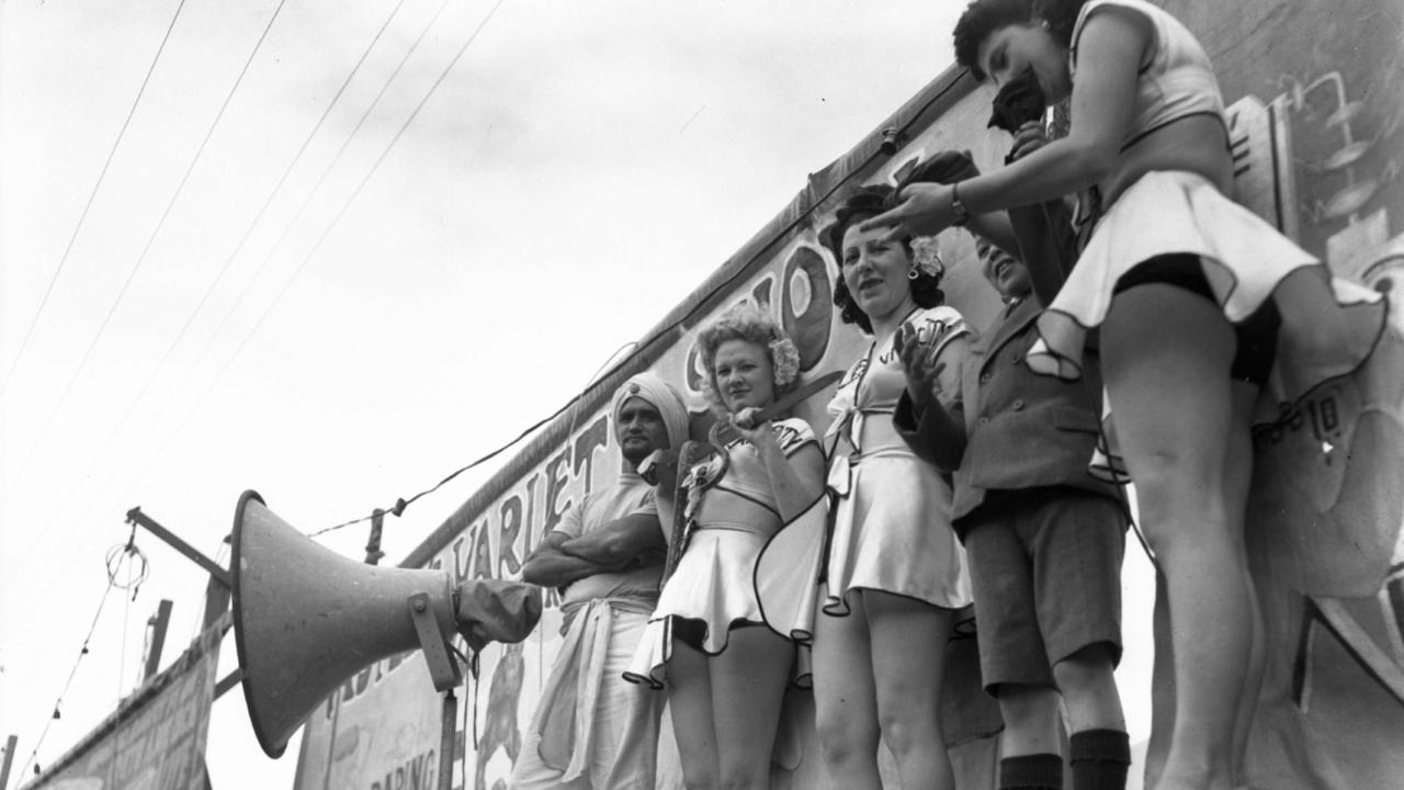 The Daring Dancing Girls callout to the crowds in Side Show Alley in 1948.