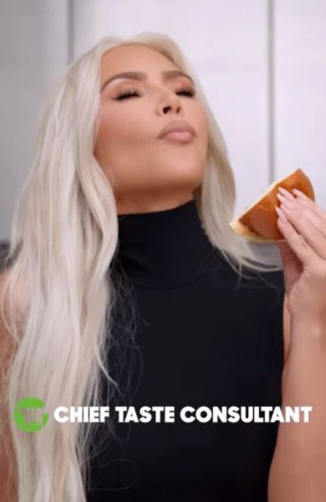 Kim Kardashian has been getting roasted over appearing to fake eat her perfect Beyond Meat burger in an ad for the plant-based meat substitute company. Picture: Instagram/BeyondMeat