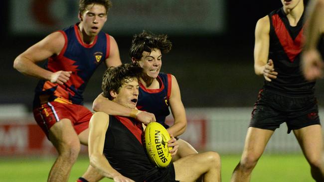 Action from Trinity’s win over Rostrevor on Wednesday night. Picture: Michael Marschall