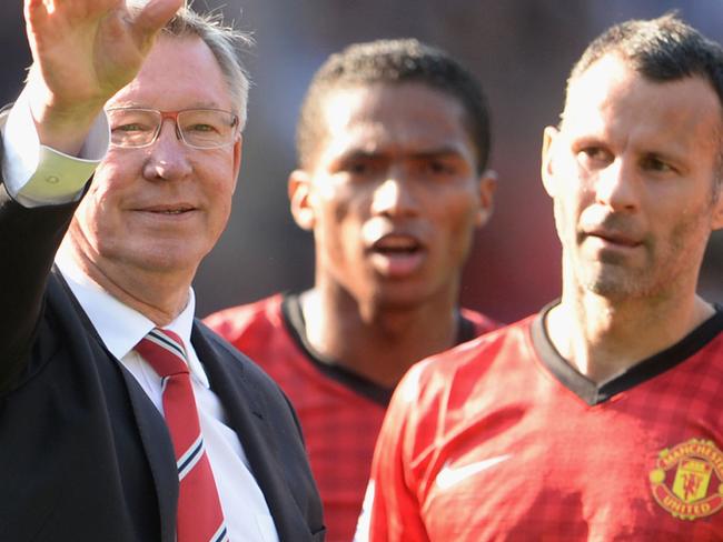 WEST BROMWICH, ENGLAND - MAY 19: Manchester United manager Sir Alex Ferguson is applauded by players Rio Ferdinand and Ryan Giggs after his 1,500th and final match in charge of the club following the Barclays Premier League match between West Bromwich Albion and Manchester United at The Hawthorns on May 19, 2013 in West Bromwich, England. (Photo by Michael Regan/Getty Images)