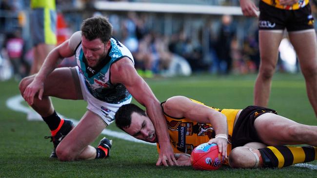 Brad Ebert tackles Hawk Jonathon Ceglar acrosst the line. Picture: AAP Image/Tracey Nearmy