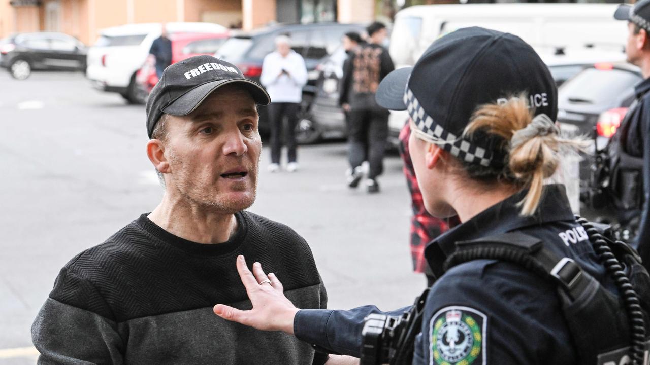 Police talk to protesters at the Westfield Marion. Picture: NewsWire/Brenton Edwards