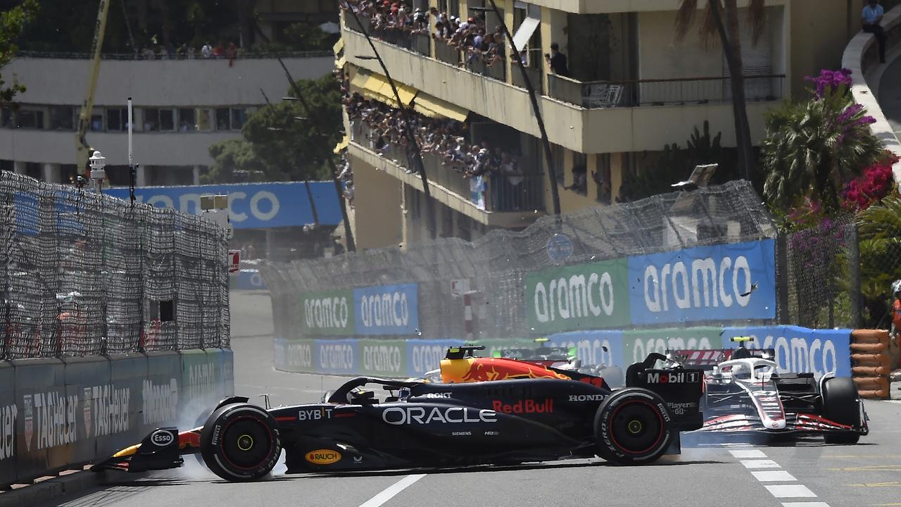 MONTE-CARLO, MONACO - MAY 26: Sergio Perez of Mexico driving the (11) Oracle Red Bull Racing RB20 and Kevin Magnussen of Denmark driving the (20) Haas F1 VF-24 Ferrari (obscured) crash at the start during the F1 Grand Prix of Monaco at Circuit de Monaco on May 26, 2024 in Monte-Carlo, Monaco. (Photo by Getty Images/Getty Images)