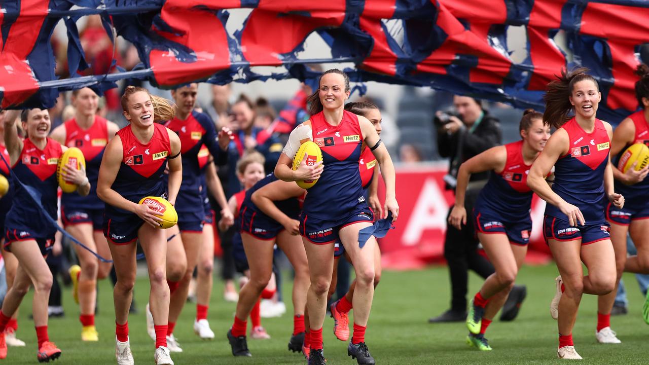 Daisy Pearce and Kate Hore, right, run out in last year’s finals series. Picture: Getty Images