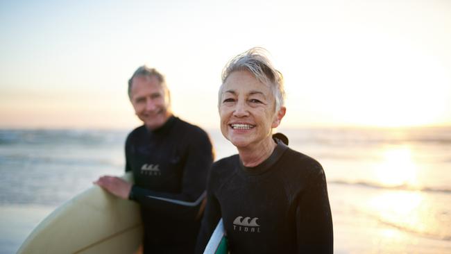 Cropped shot of a senior married couple coming from surfing