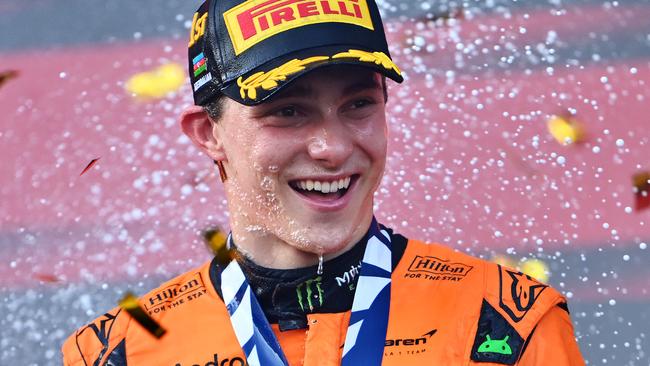 BAKU, AZERBAIJAN - SEPTEMBER 15: Race winner Oscar Piastri of Australia and McLaren celebrates on the podium during the F1 Grand Prix of Azerbaijan at Baku City Circuit on September 15, 2024 in Baku, Azerbaijan. (Photo by Dan Mullan/Getty Images)