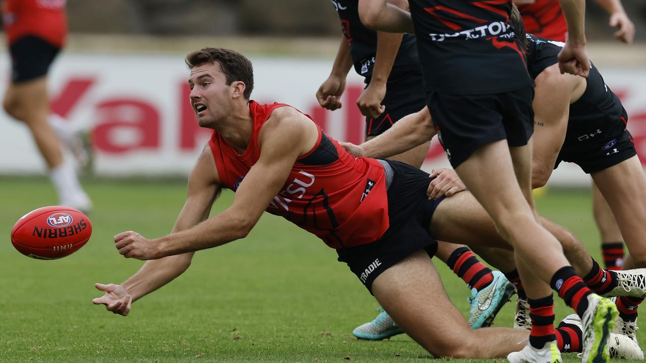 Zach Reid dishes out a handball. Picture: Michael Klein