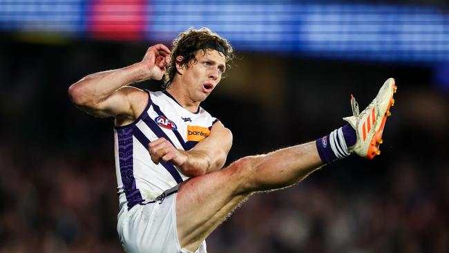 MELBOURNE, AUSTRALIA - JULY 01: Nat Fyfe of the Dockers kicks the ball during the 2023 AFL Round 16 match between the Western Bulldogs and the Fremantle Dockers at Marvel Stadium on July 1, 2023 in Melbourne, Australia. (Photo by Dylan Burns/AFL Photos via Getty Images)