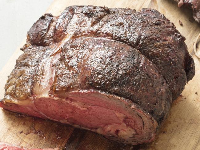 This undated photo provided by America's Test Kitchen in June 2018 shows a grill-roasted prime rib in Brookline, Mass. This recipe appears in the â€œThe Cook's Illustrated Meat Book.â€ (Daniel J. van Ackere/America's Test Kitchen via AP)