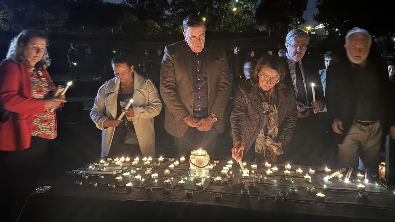 Federal MP Milton Dick (centre) at the candlelight vigil for Muzhda Habibi. Picture: Tayla Couacaud