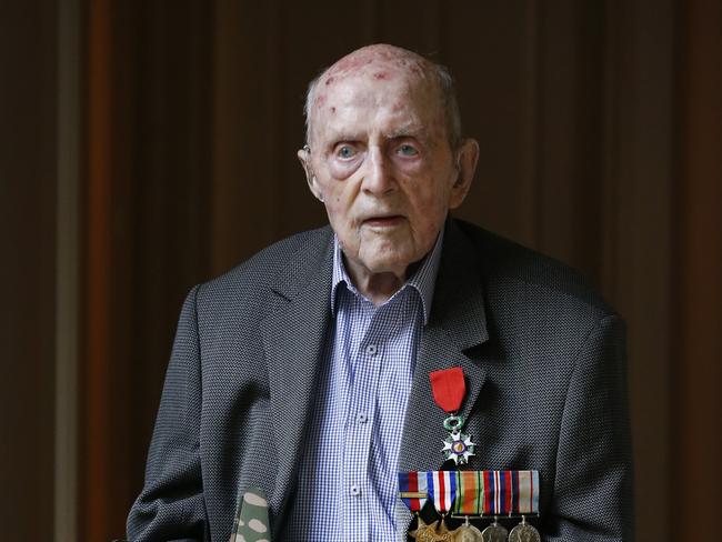 Anzac Day feature. WW2 veteran bomber pilot Laurie Larmer 97, flew bombers out of England including the Halifax bomber. Laurie Larmer 97, reflects as he holds a model of a Halifax bomber that he flew during the war.                         Picture: David Caird