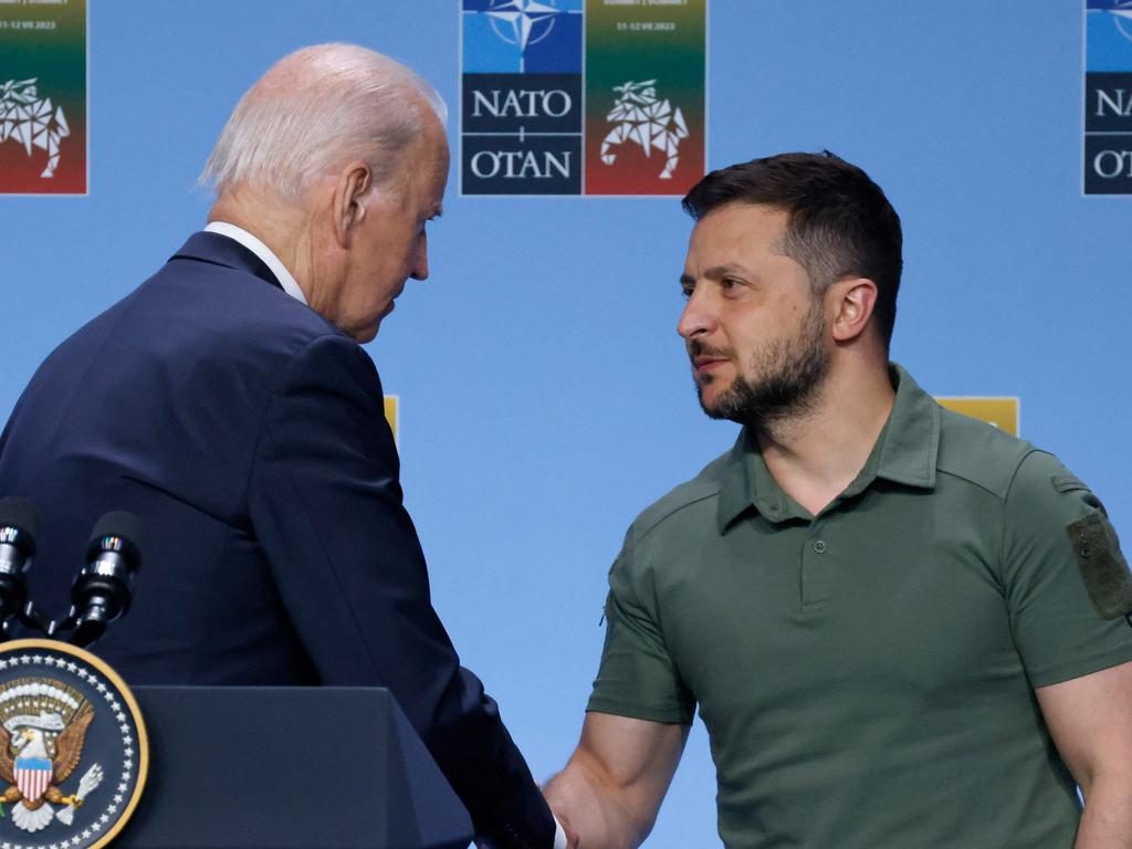 US President Joe Biden shakes hands with Ukraine President Volodymyr Zelensky during the NATO summit. Picture: Ludovic Marin (AFP)