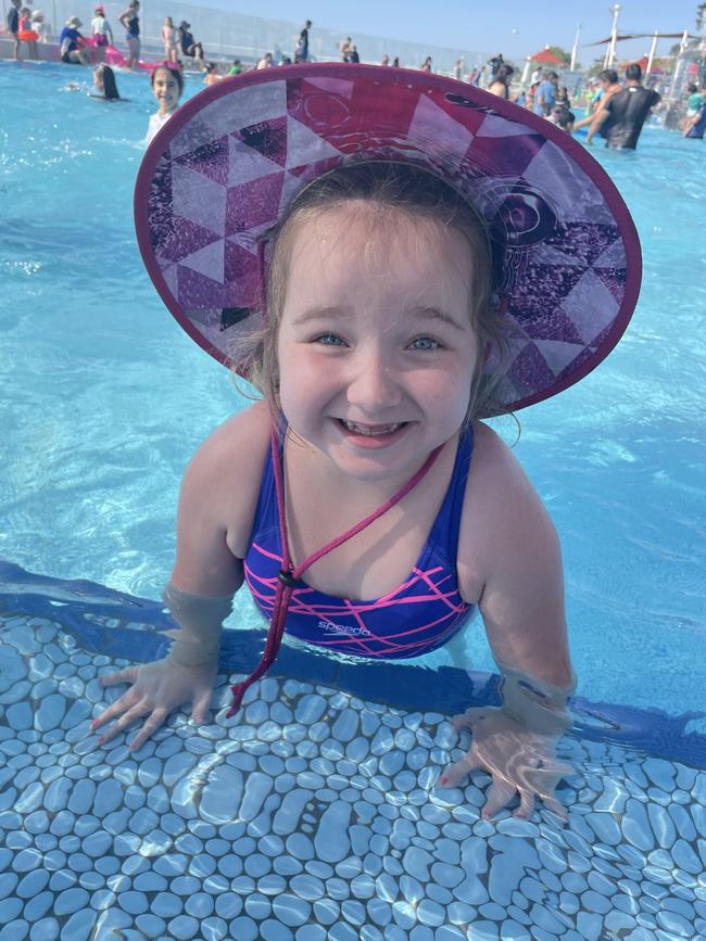 Ruby England pictured going for her first swim without a dialysis tube in tummy, after getting her new kidney.