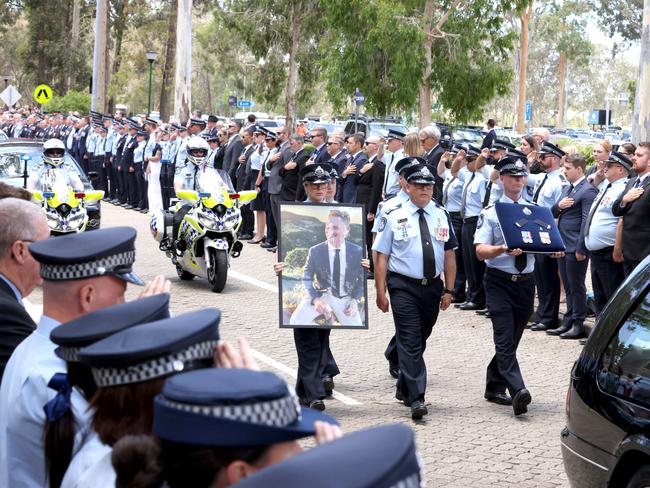 Mourners at the memorial service with full police honours for fallen constables Rachel McCrow and Matthew Arnold at Brisbane Entertainment Centre. Picture: Steve Pohlner