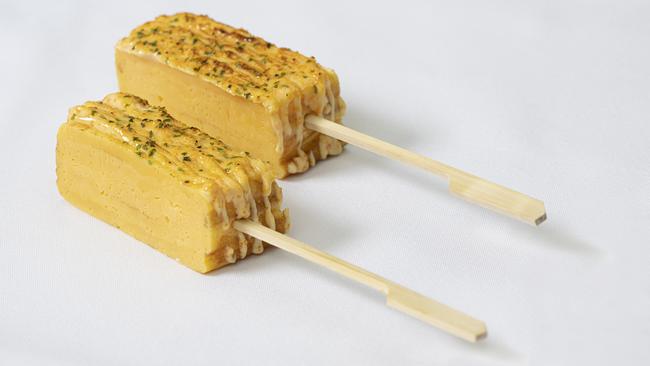 Tamagoyaki (Japanese omelette) on a stick.