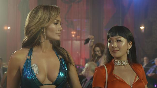 Jennifer Lopez as Ramona and Constance Wu as Destiny in Hustlers, based on a true story about a group of New York strippers who fleece their clients.