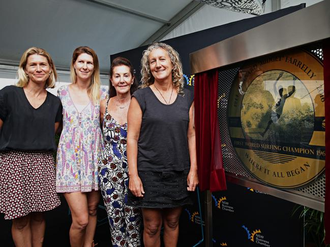 Beverlie Farrelly and her daughters Priscilla, Johanna and Lucy with the Australian Open of Surfing tribute plaque unveiled at Manly in 2017 to their father and husband, Midget Farrelly. Picture: Adam Yip/The Manly