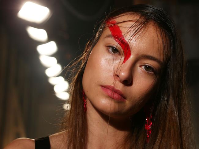 A model poses backstage before she takes the catwalk. Picture: Lisa Maree Williams/Getty Images.