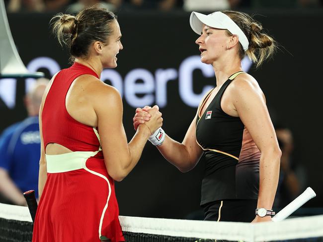 MELBOURNE, AUSTRALIA - JANUARY 23: Aryna Sabalenka (L) embraces Barbora Krejcikova of Czech Republic after winning their quarterfinals singles match during the 2024 Australian Open at Melbourne Park on January 23, 2024 in Melbourne, Australia. (Photo by Cameron Spencer/Getty Images)