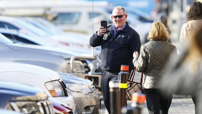 A Hobart City Council parking officer checking cars in the Salamanca precinct. Picture: MATT THOMPSON