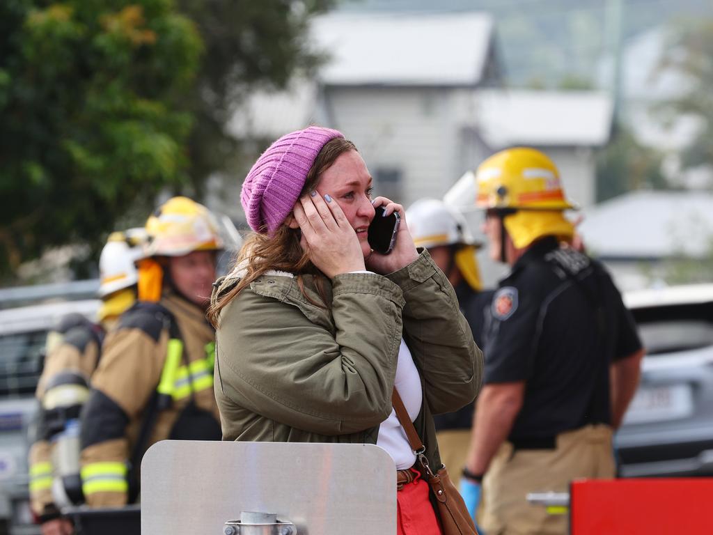 A resident on Saturday looks on at the scene of a massive fire in Grange which has impacted at least three homes. Photo: David Clark.