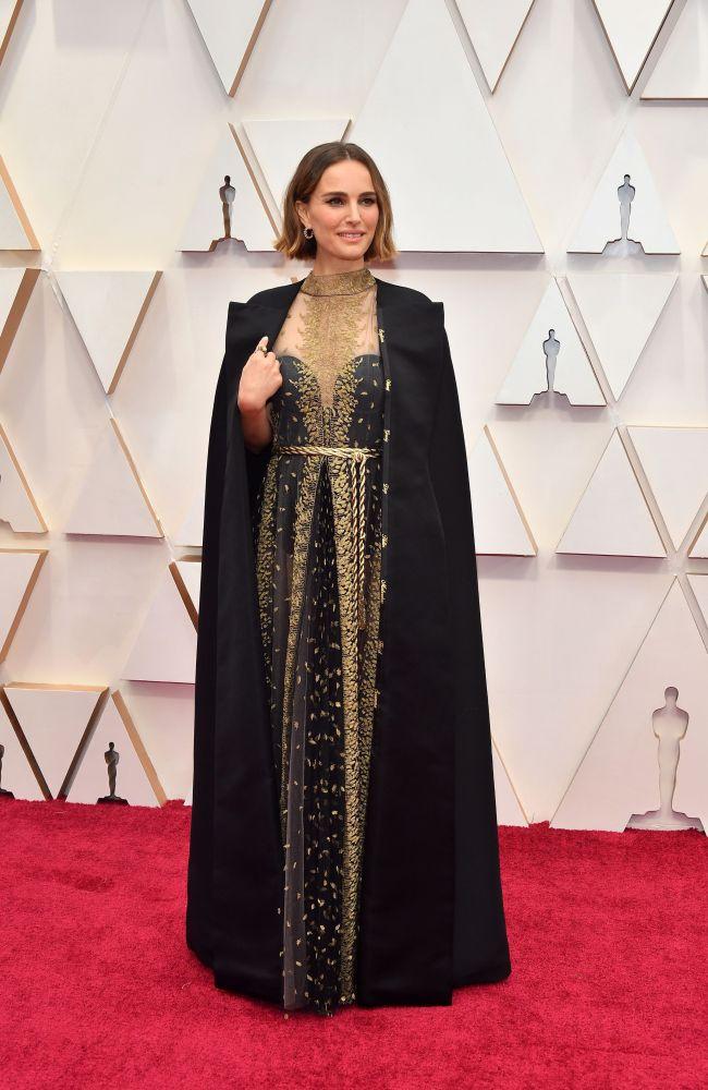 Natalie Portman wears the names of all the female directors who were snubbed on her coat. Picture: Amy Sussman/Getty