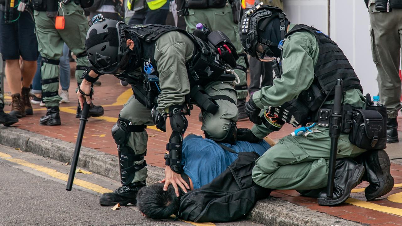 A pro-democracy supporter is detained by riot police during an anti-government rally on May 24, 2020 in Hong Kong. Picture: Getty Images