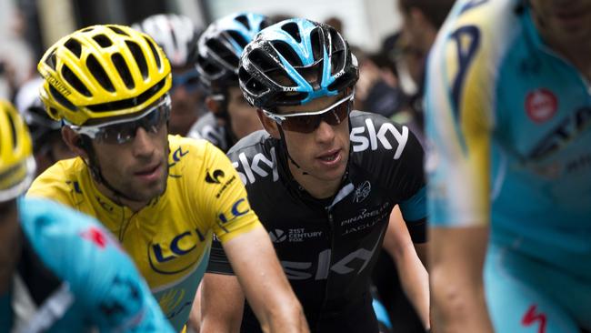 Vincenzo Nibali (L) wearing the overall leader's yellow jersey and Australia's Richie Porte