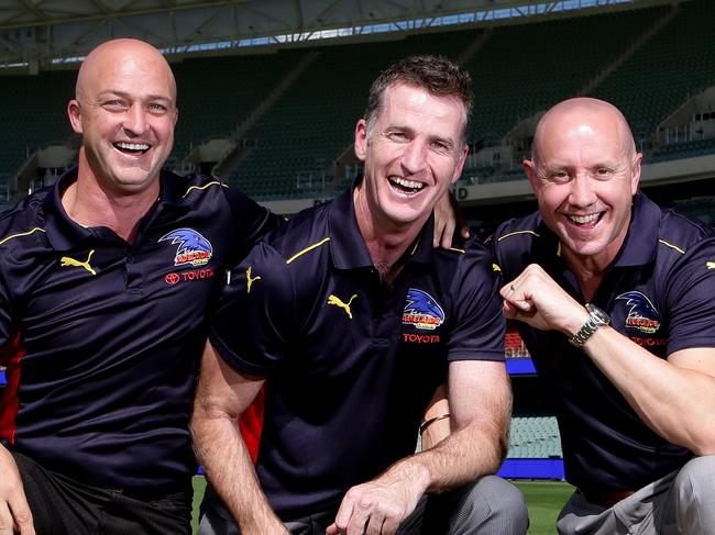 AFL - Crows past Players - Kym Koster, Peter Caven and Rod Jameson at Adelaide Oval with the two Grand Final cups. PIC SARAH REED