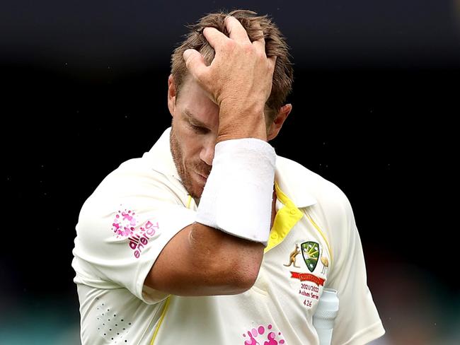 SYDNEY, AUSTRALIA - JANUARY 05: David Warner of Australia reacts to losing his wicket during day one of the Fourth Test Match in the Ashes series between Australia and England at Sydney Cricket Ground on January 05, 2022 in Sydney, Australia. (Photo by Mark Kolbe/Getty Images)