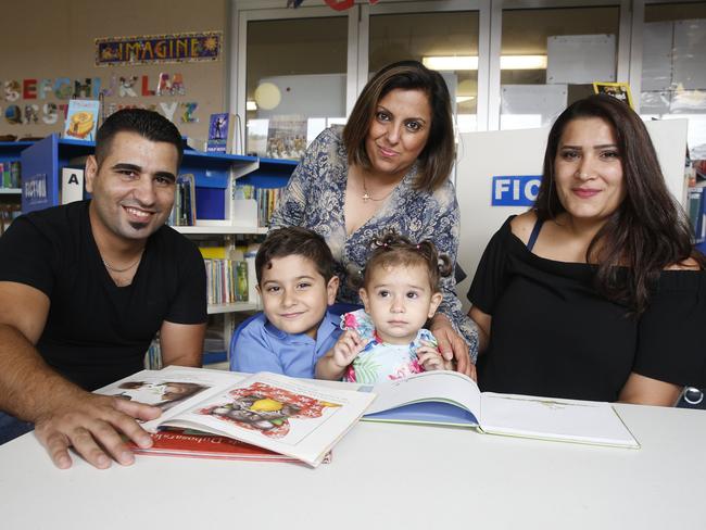 Iraqi Translator Sana Yonan (middle) teaching English at Mt Druitt. Picture: David Swift