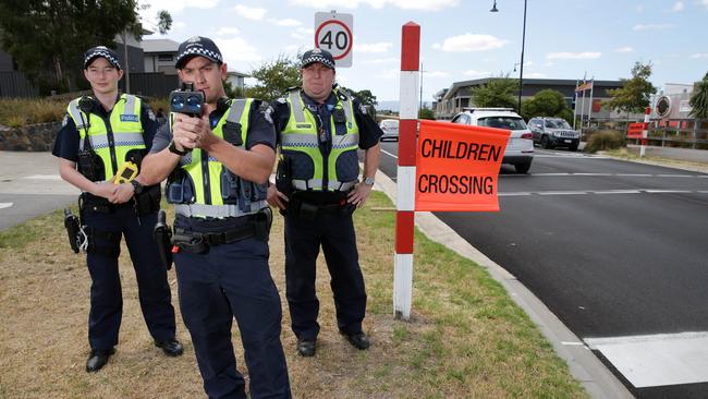 Police officers Victoria Lennon, Adam Glogolia and Glenn Young at the problem school crossing. Picture: George Salpigtidis