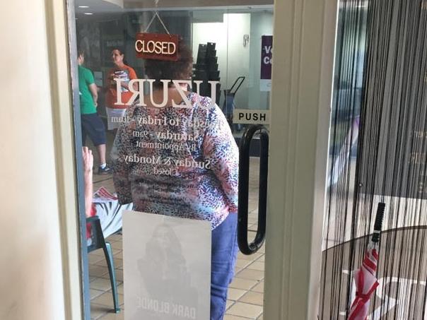 This campaigner for Kathy Ganley couldn't have done much more to obstruct the entrance to her CBD business, Uzuri Hair. Picture: Supplied