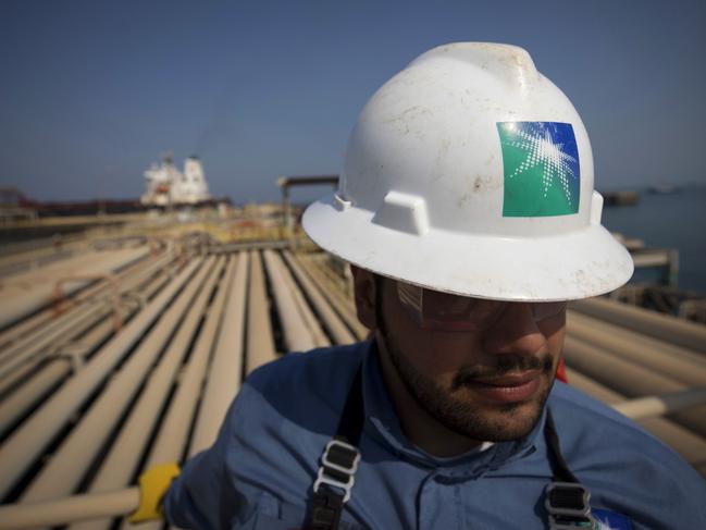 An employee stands near pipes used for landing and unloading crude and refined oil at the North Pier Terminal, operated by Saudi Aramco, in Ras Tanura, Saudi Arabia, on Monday, Oct. 1, 2018. Saudi Aramco aims to become a global refiner and chemical maker, seeking to profit from parts of the oil industry where demand is growing the fastest while also underpinning the kingdom’s economic diversification. Photographer: Simon Dawson/Bloomberg