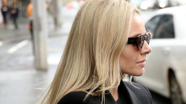 Kelsea Doyle, the glamorous wife of Matthew Doyle, pictured as she leaves Downing Centre Court following his original sentencing which is now the focus of an appeal. She has not been accused of any wrongdoing. Picture: NCA NewsWire / Damian Shaw