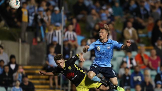 Sydney FC defender Rhyan Grant wins a header against Wellington at Leichhardt Oval. Picture: Brett Costello