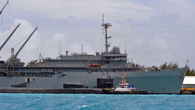 Australian navy personnel have been aboard the US submarine tender USS Emory S. Land (rear) for several months learning to maintain and sustain nuclear-powered subs. Picture: US Navy